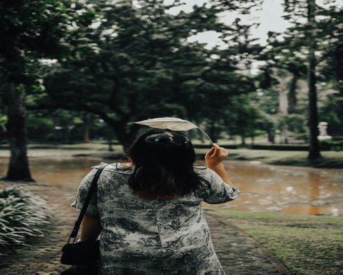 Woman taking a walk in a Jakarta park during weekend